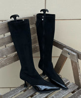 Botas vaqueras de tacón alto con empalme elegante y punta azul